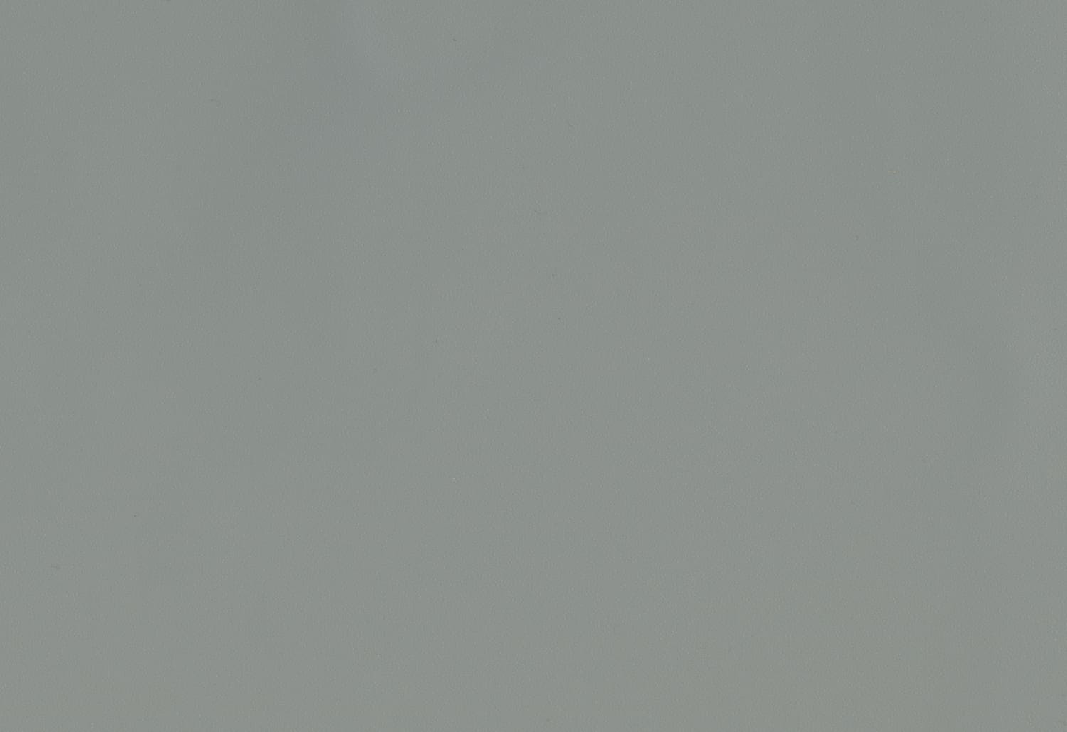 A plane flying in the sky with a grey background.