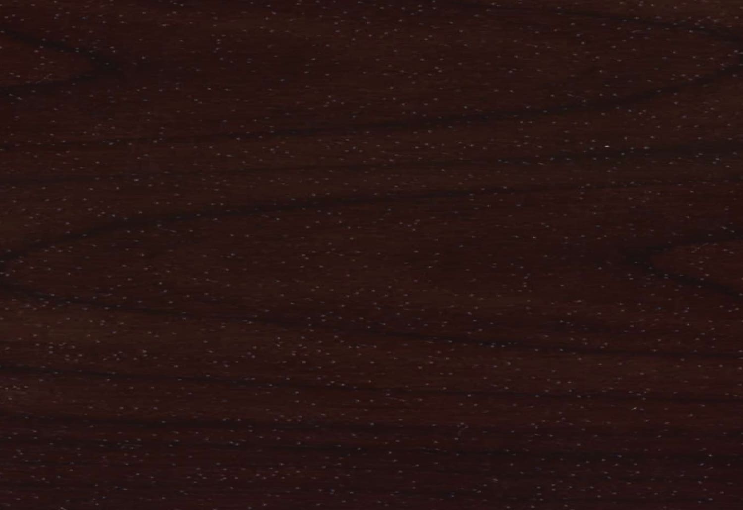 A close up image of a dark brown wood surface.